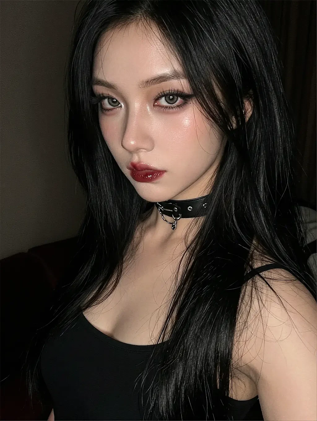 Fictional AI character with black hair and a studded choker in a dim room